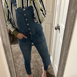 Medium wash, skinny overalls.